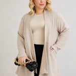Elegante Strickjacke mit Lurex – offen und mit Taschen in Übergrößen
