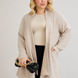 Elegante Strickjacke mit Lurex – offen und mit Taschen in Übergrößen